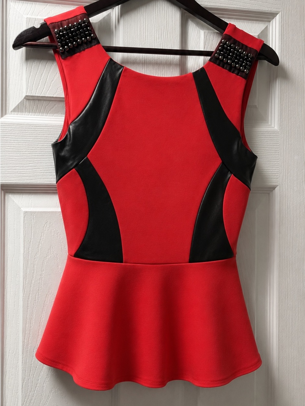 bebe Red Peplum Top with Black Faux Leather Insets and Studded Shoulders